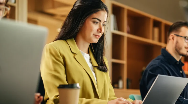 An image of a business woman analysing her website statistics on a laptop