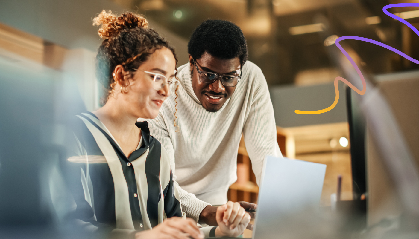 An image showing two people reviewing the GEO work done for them. They look happy with the results.