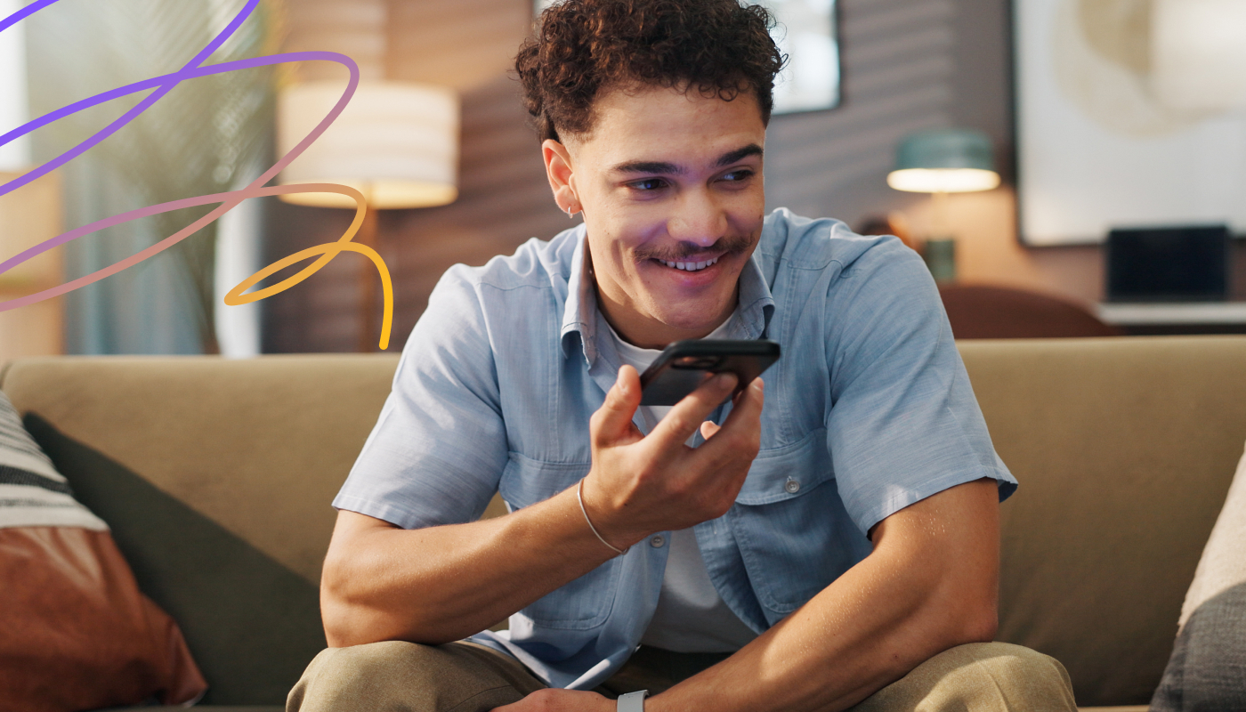 An image showing a man performing a voice search using an AI based search engine on his mobile phone