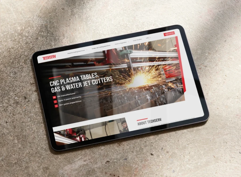 Techserv website displayed on a tablet on an industrial concrete background