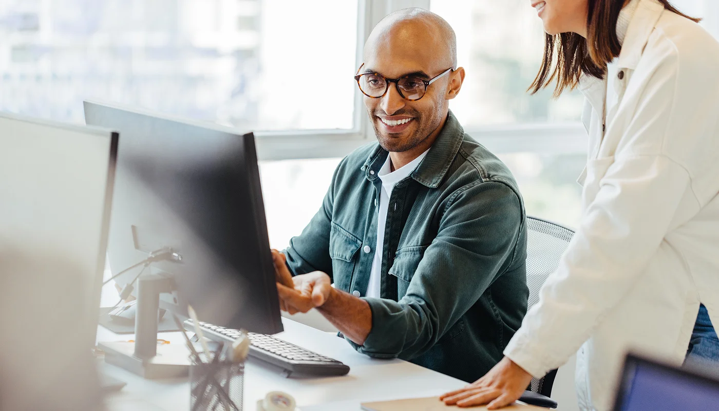 professionals in office reviewing a website
