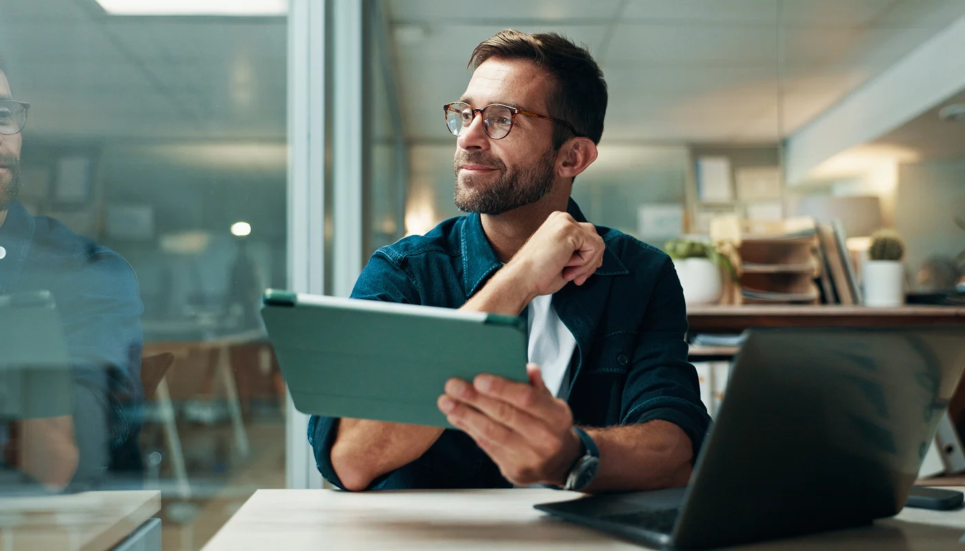 web developer holding a tablet