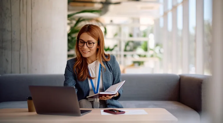 professional woman using a website maintenance checklist to maintain her website