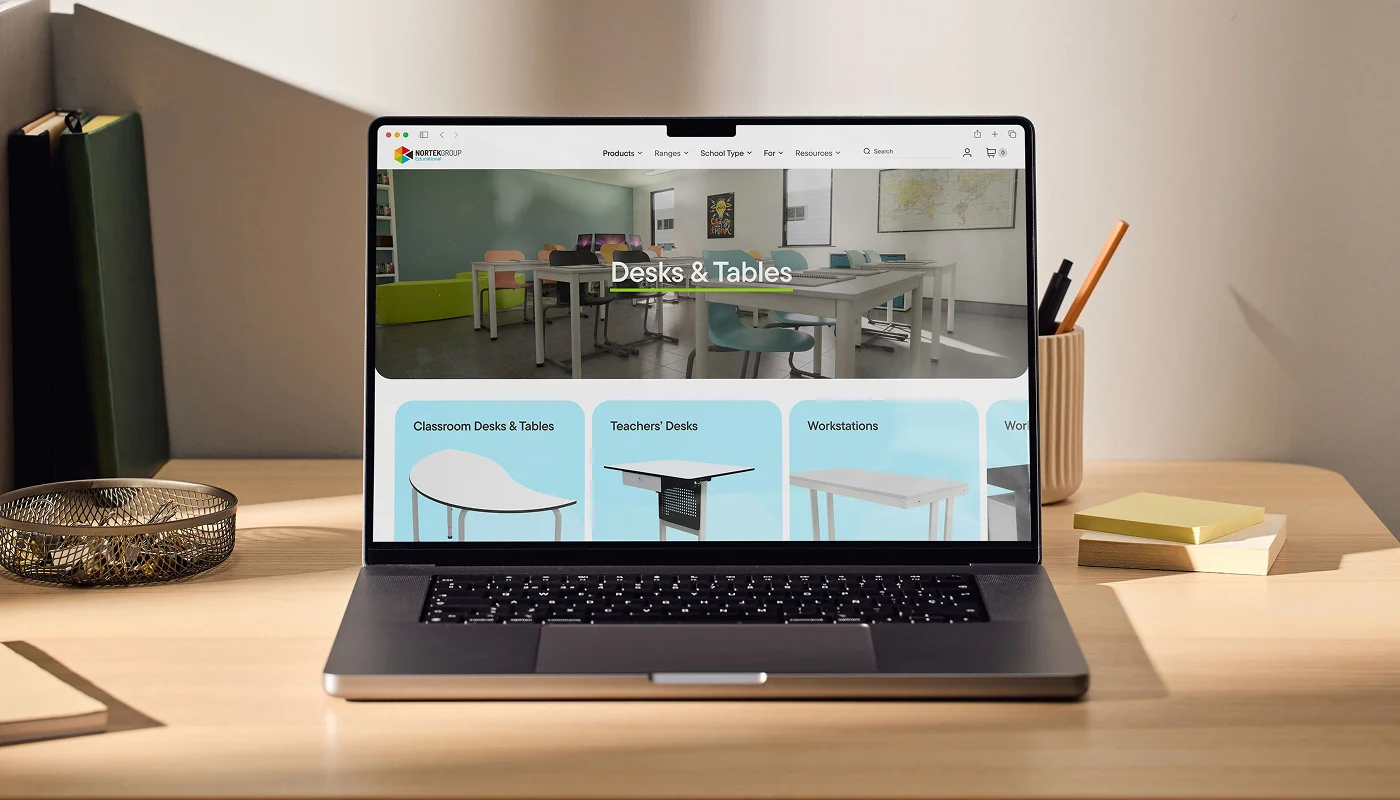 new website development on a laptop on top of wooden desk